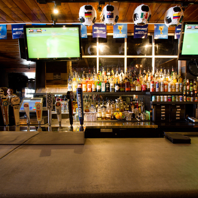 Bar area, full bar, big tv screens and beer taps