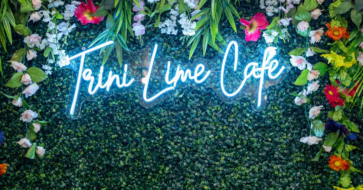 Neon sign on a green wall