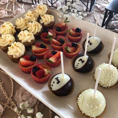 Assorted cake pops and cupcakes