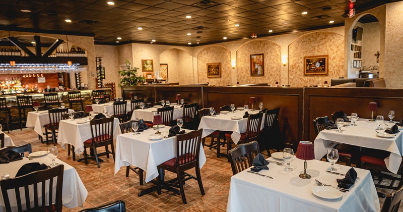 Restaurant interior, dining area with set dining tables