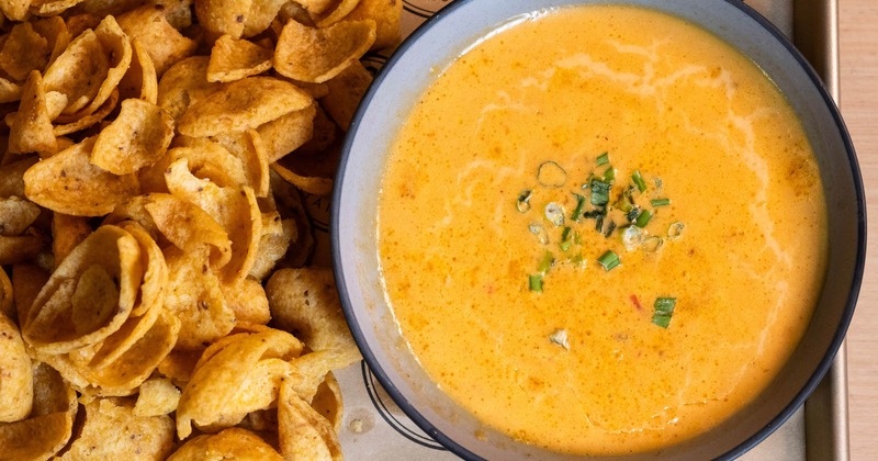 Beef, tomatoes, and green chile cheese dip, served with corn chips