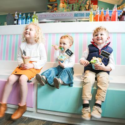 Three kids posing for a photo