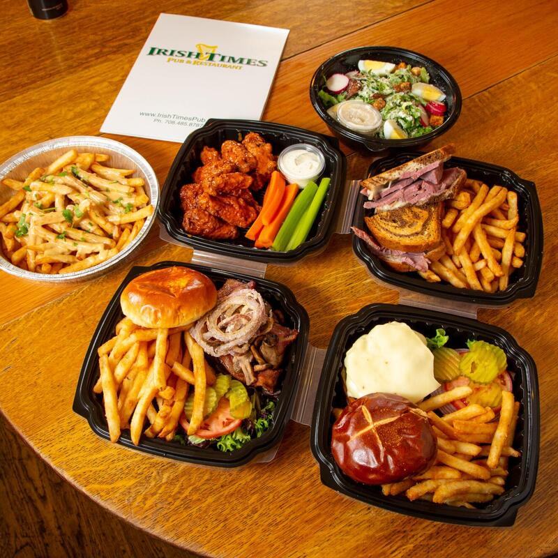 Various dishes in take out containers on the table