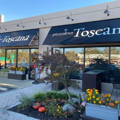 Exterior, the restaurant name on the awning