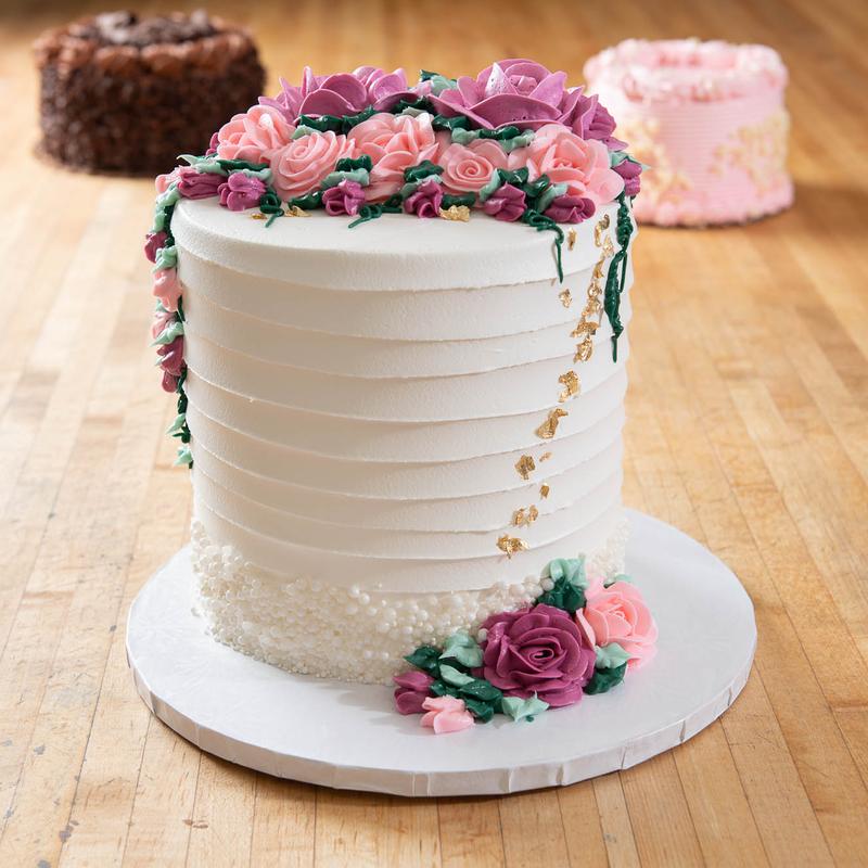 White cake with floral gum paste garnish