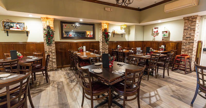 Restaurant interior, dining area with set tables, Christmas atmosphere
