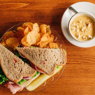 Daily soup and two sandwiches served with chips, top view