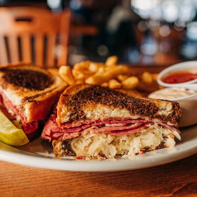 Reuben sandwiches served with dip and fries