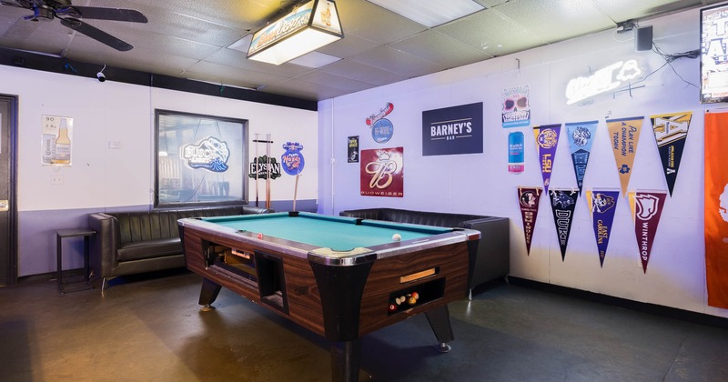 Inside, pool table with wall decoration