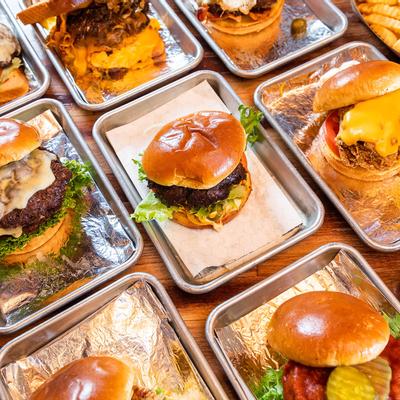 Various burgers served on plates