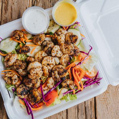 grilled shrimp salad with two dips, photo taken from above