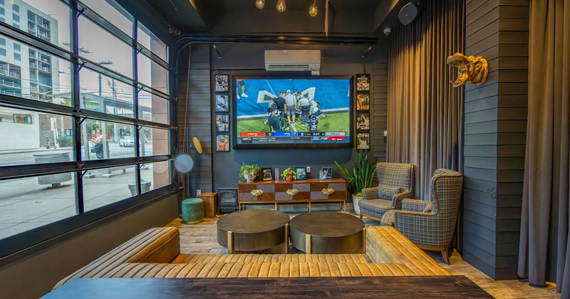 Interior, seating area, large TV screen on the wall