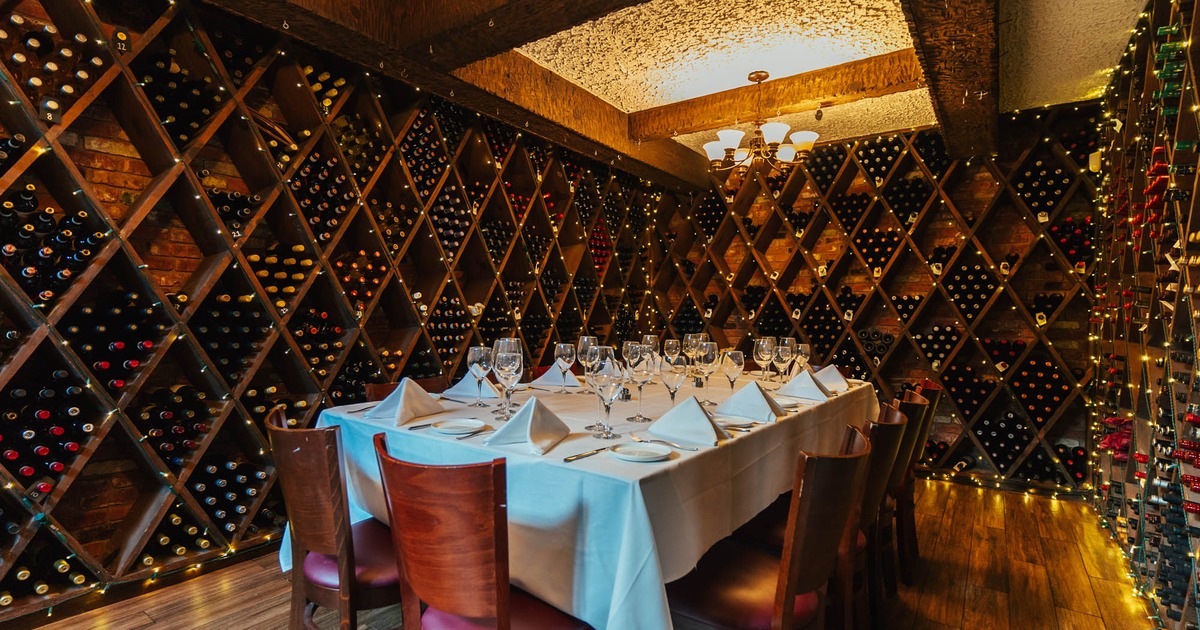 Interior, wine cellar, fully set dining table