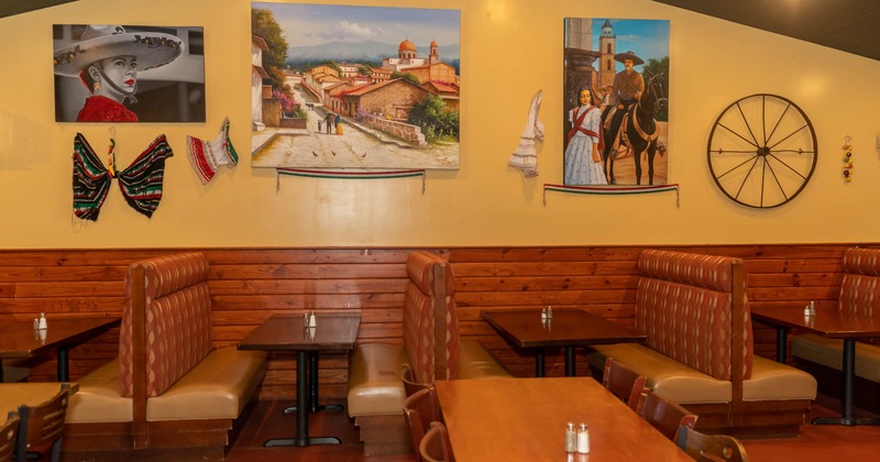 Interior, tables and sitting booths, pictures on the wall