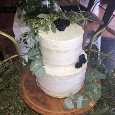 White cake decorated with blackberries