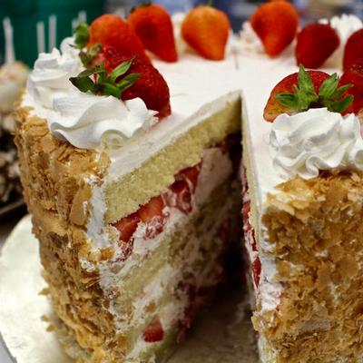 Strawberry cake decorated with whole strawberries