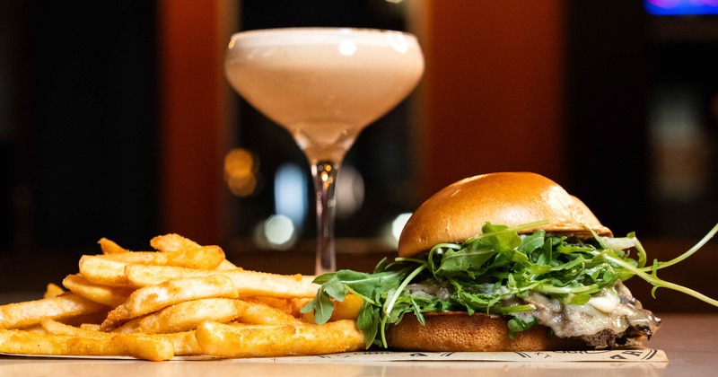 Mushroom Swiss Smashed Burger, fries, and an Espresso Martini