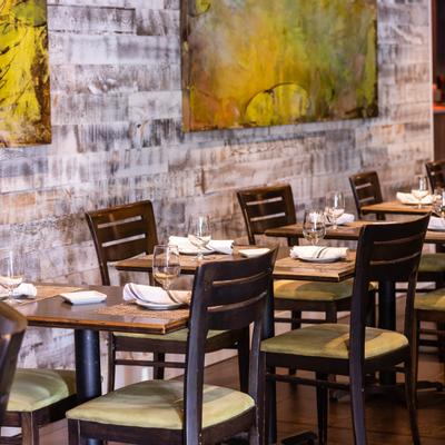 Indoor, tables for two set for guests