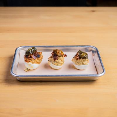 Jalapeno Popper Deviled Eggs on a  plate.