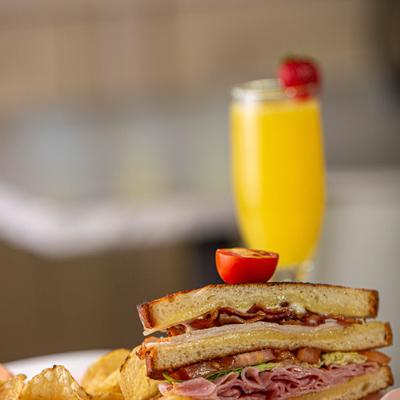 Turkey Club Sandwich and chips