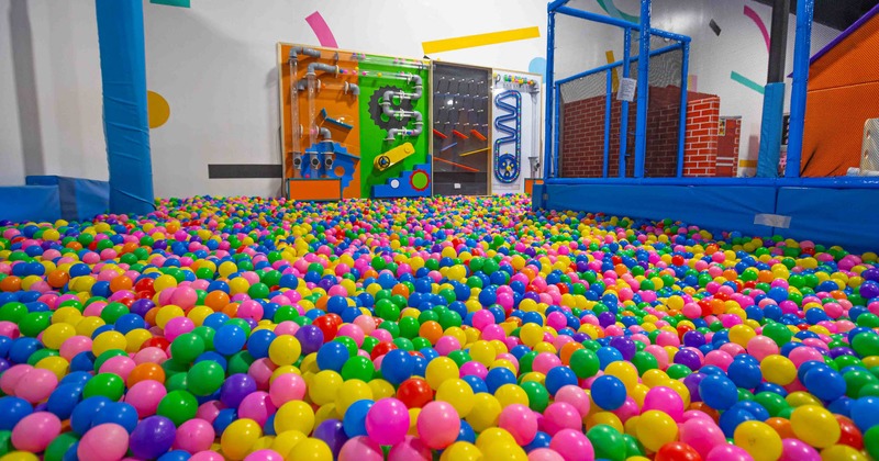 Indoor, kid's playground with a lot of plastic balls