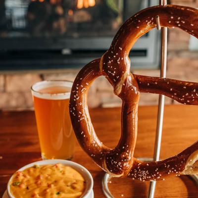Soft jumbo pretzel served with cheese dip