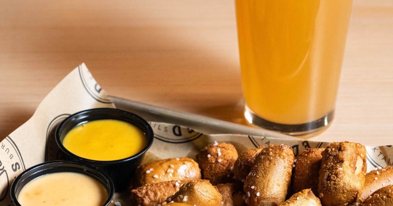 Pretzel Bites, with honey mustard, beer cheese, and a glass of beer