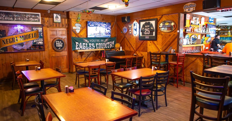 Interior, dining area, tables and chairs, Eagles banner, framed McCoy jersey, various decorations