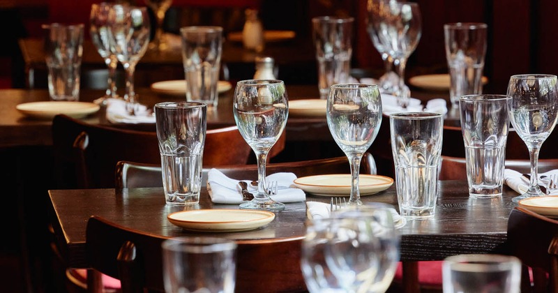 Interior, set tables with glasses and tableware