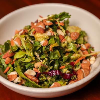 Asian Slaw salad with shredded carrots, cabbage, and blood orange vinaigrette dressing.
