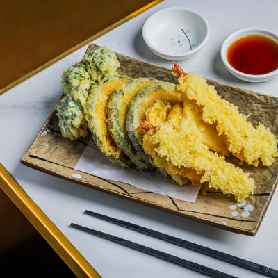 Mix Tempura plate with shrimp, vegetables and dipping sauce.