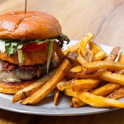 House burger served with fries.