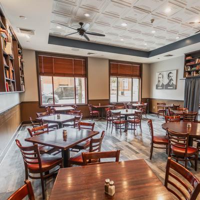 Tables and chairs in seating area.