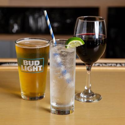 Glasses of different types of drinks on a bar counter