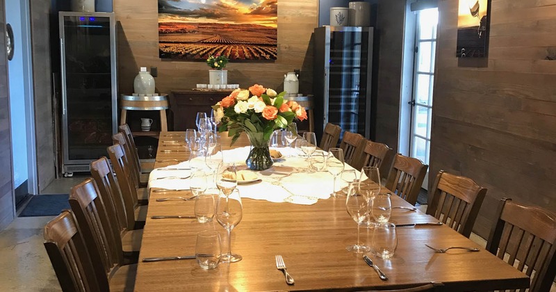 Inside, long seating table, tableware, flowers