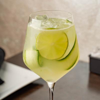 Gin and tonic with lime and cucumber.