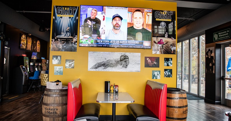 Dining table by the wall with TV