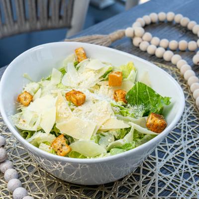 Caesar salad, served, front view.