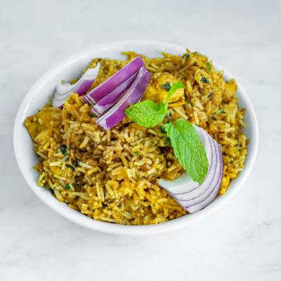 Boneless chicken, with basmati rice, herbs, and spices.