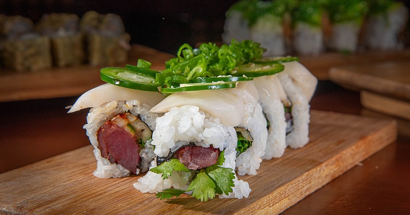 Tuna rolls topped with whitefish and jalapenos