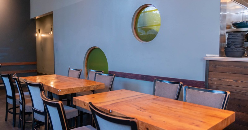 Interior, two wooden tables with chairs