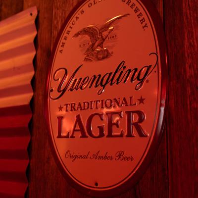 A beer plaque on a wall.