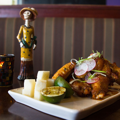 Fried chicken with a candle in the back