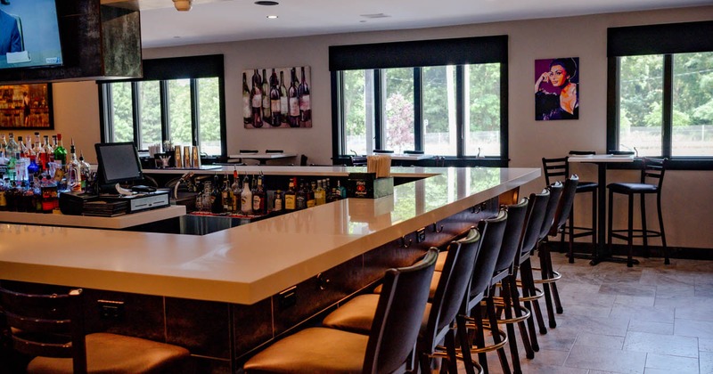 Interior, tables set for guests,  dining area