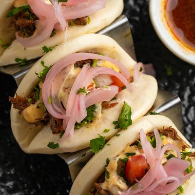 Served birria bao