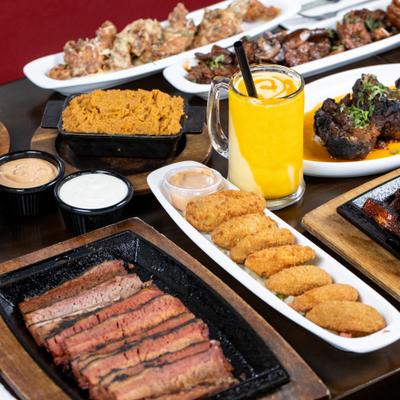 Variety of appetizers served on the table with a cocktail.