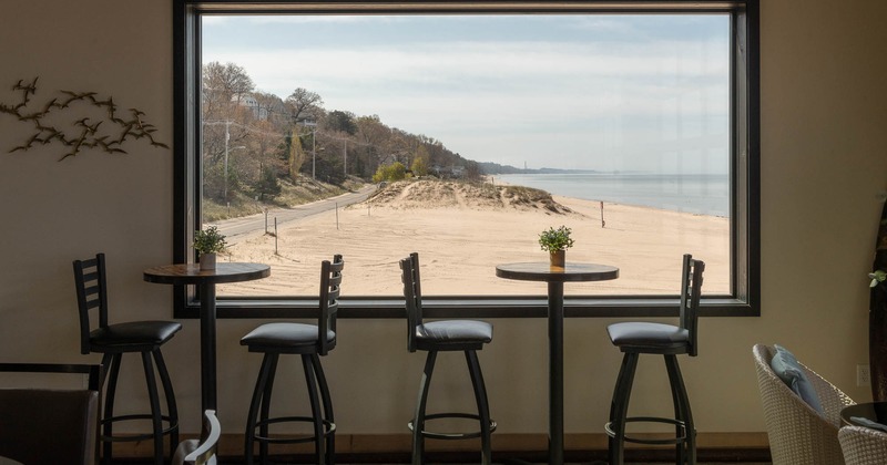 Interior, high seating chairs and tables by the window