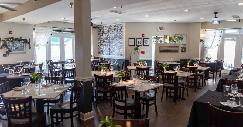 Inside, dining tables ready for guests, decoration
