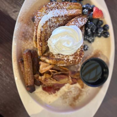 A dessert served with whipped cream on top, top view