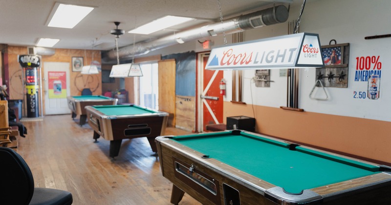 Interior, three pool tables